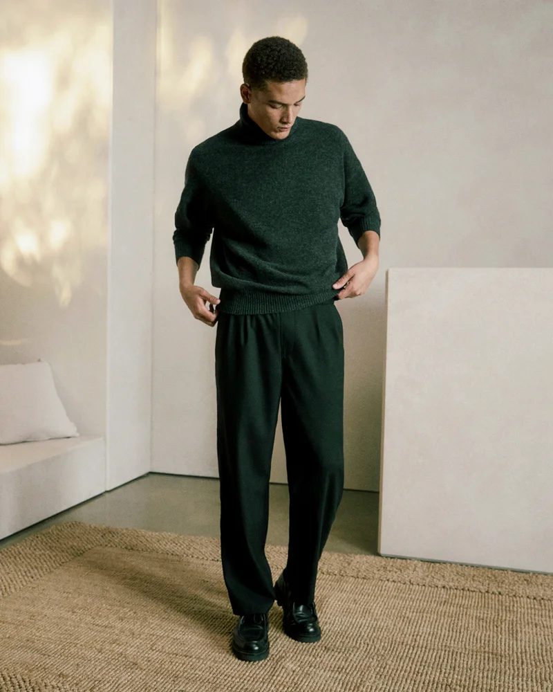 Image | Model in Luxe Merino Relaxed Turtleneck