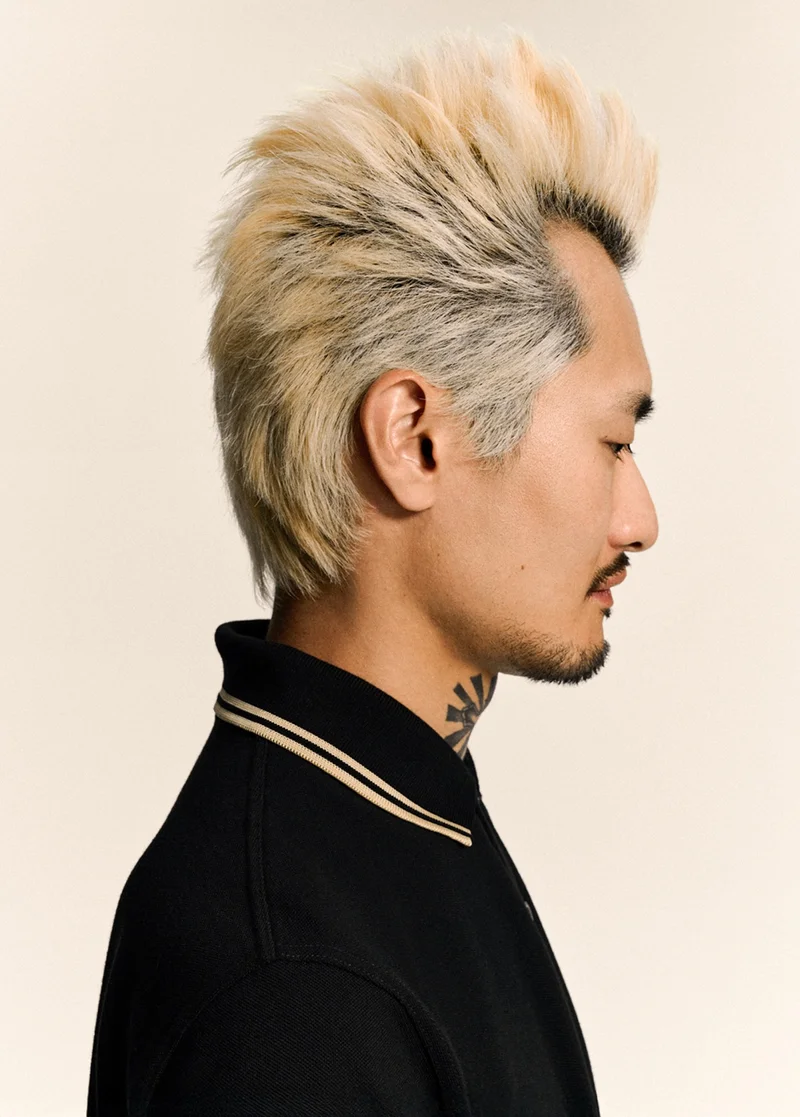 Seen in Japan: model wears our Made in England Fred Perry Shirt in Black / Champagne / Champagne