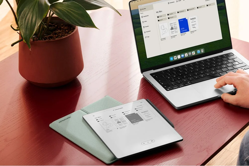 reMarkable Paper Pure next to someone working on a Mac