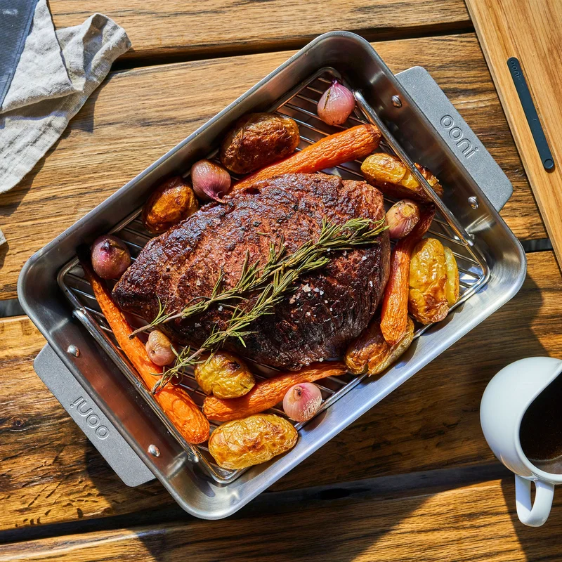 Ooni's NEW Roasting Pan with beef, potatoes and carrots beautifully cooked inside