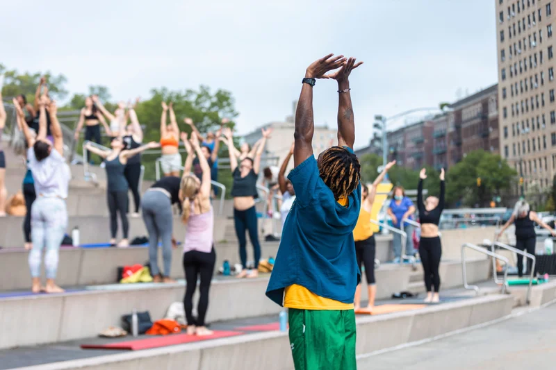 People doing outdoor yoga