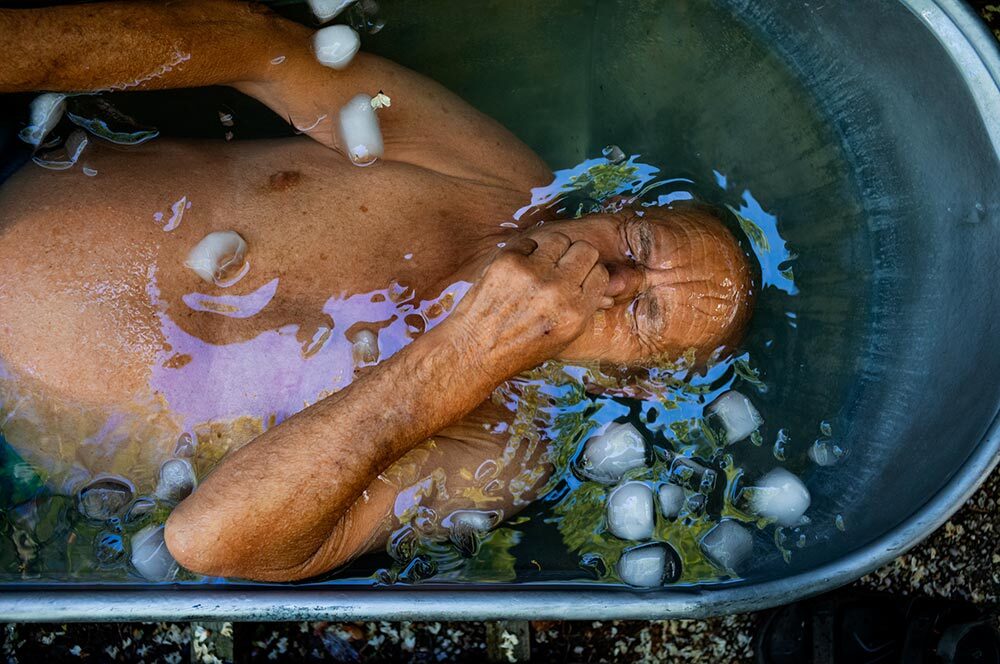 A man takes an ice bath in an antique tub in Zwolle, Netherlands.