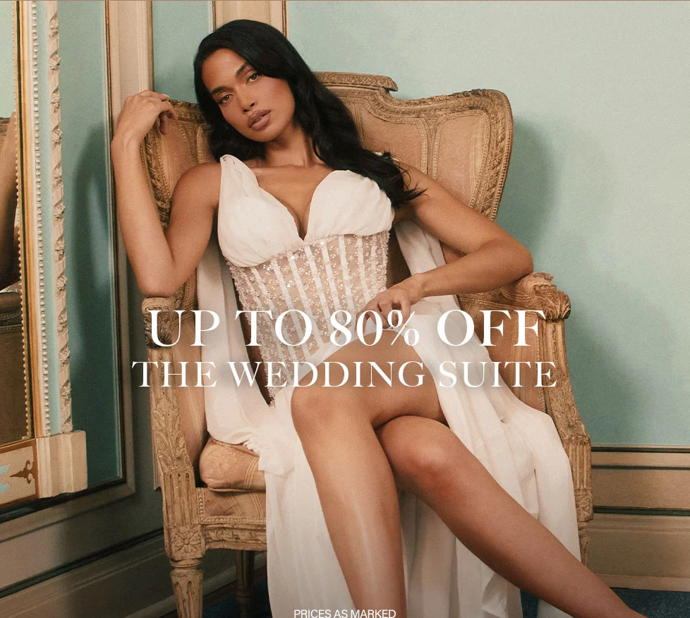 Up to 80% off The Wedding Suite sale! Elegant bride in white embellished corset gown. Shop bridal dresses & wedding outfits.