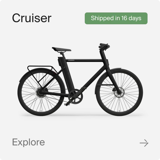 A graphic composition showing a Cowboy Cruiser bike. Text in the image reads "Cruiser", "Shipped in 16 Days" and "explore".