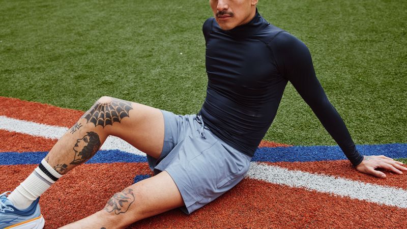 best workout shorts for men Image may contain: Clothing, Footwear, Shoe, Adult, Person, and Pain
