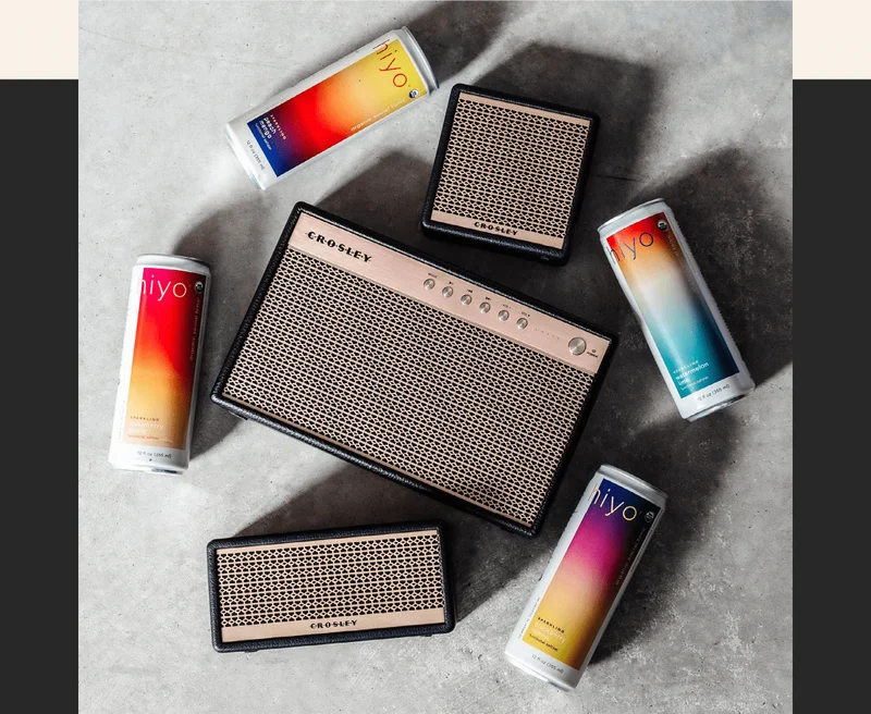 image: hiyo organic social tonics and crosley montero bluetooth speakers.
