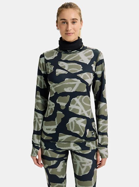Model wearing the Women's Burton Midweight Base Layer Long Neck Shirt in the Graffit Camo print