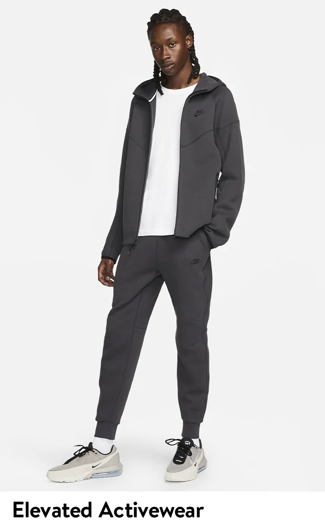 Man wearing Nike Tech Fleece sweathshirt and joggers.