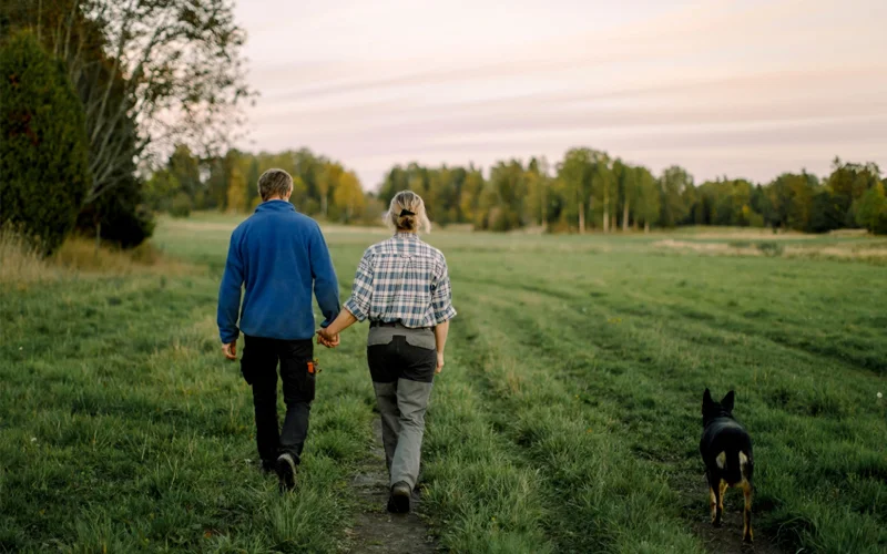 A couple takes a sunset stroll.