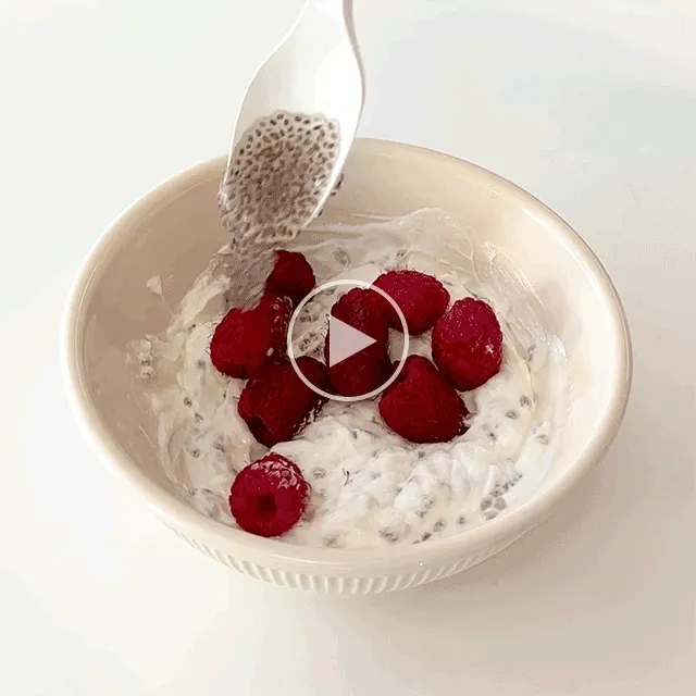 Chia seeds mixed into yogurt with berries and other toppings.