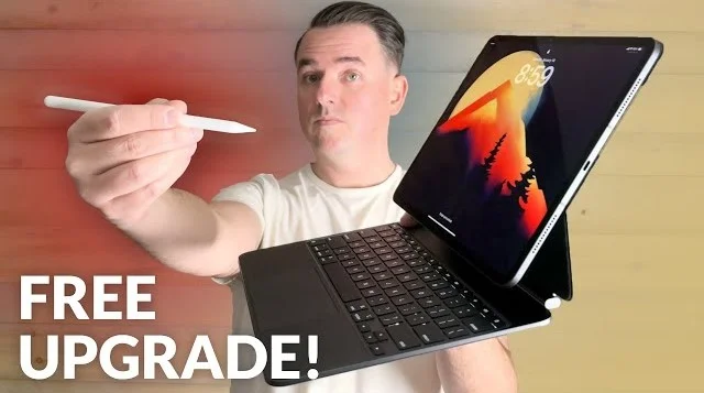 Image of a man holding an iPad with a keyboard case attached and an Apple Pencil with the words “Free upgrade!” in front.