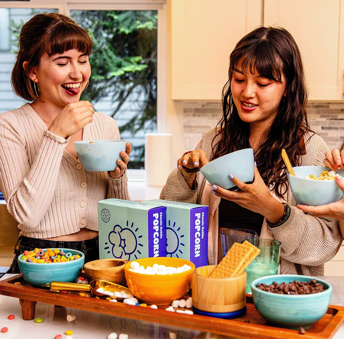 GIF - two friends enjoying Popsmith popcorn together