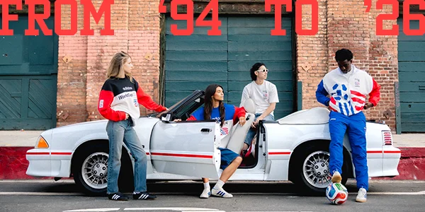 Models posing outside of a car
