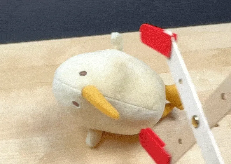 (Shows grabber claw picking up a plushie)