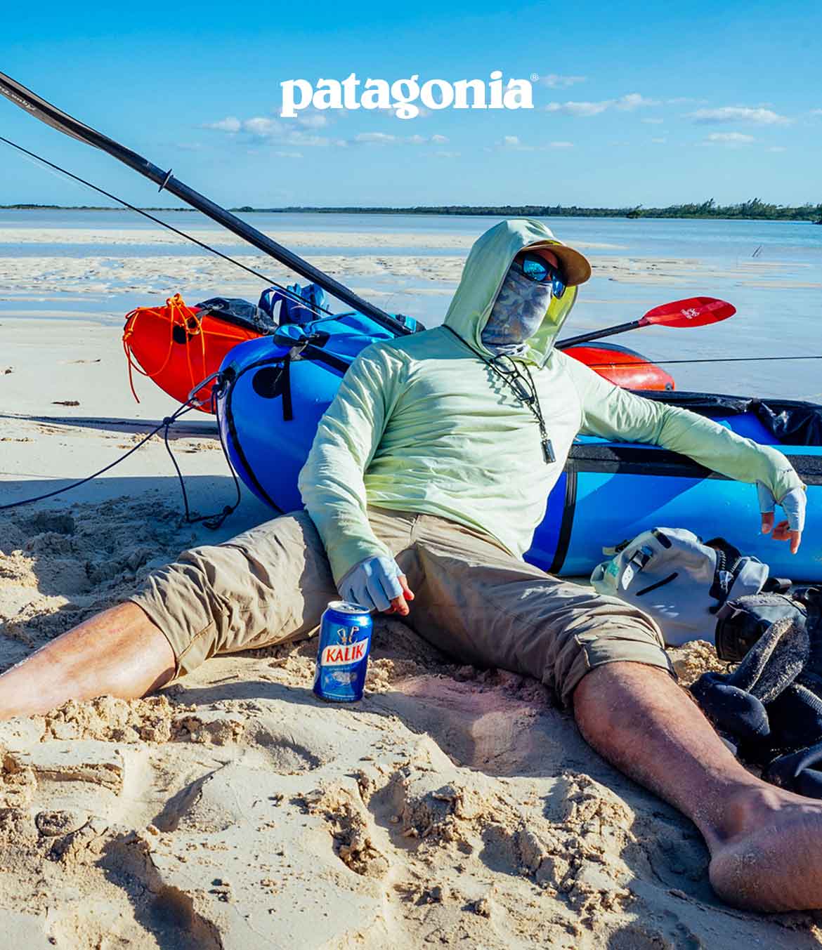 Patagonia. An angler sits on the beach exhausted from the tropical heat.