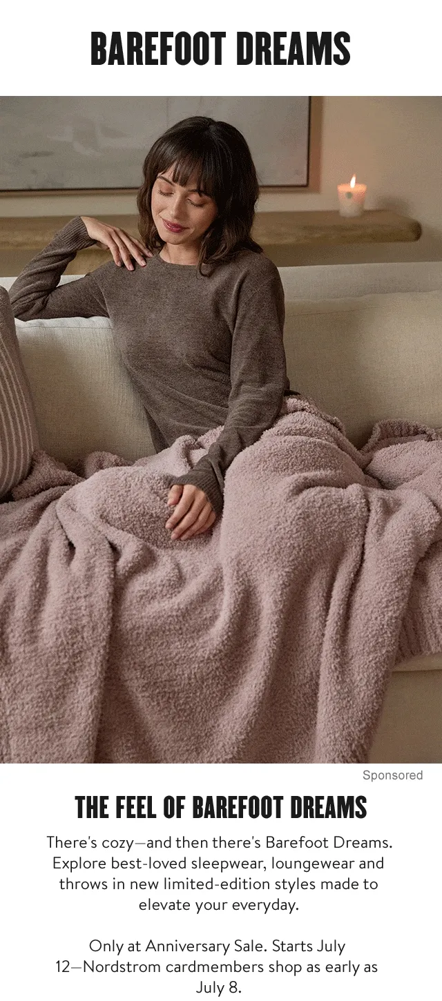 Woman lounging underneath a blanket; woman wearing loungewear; woman wearing a robe.