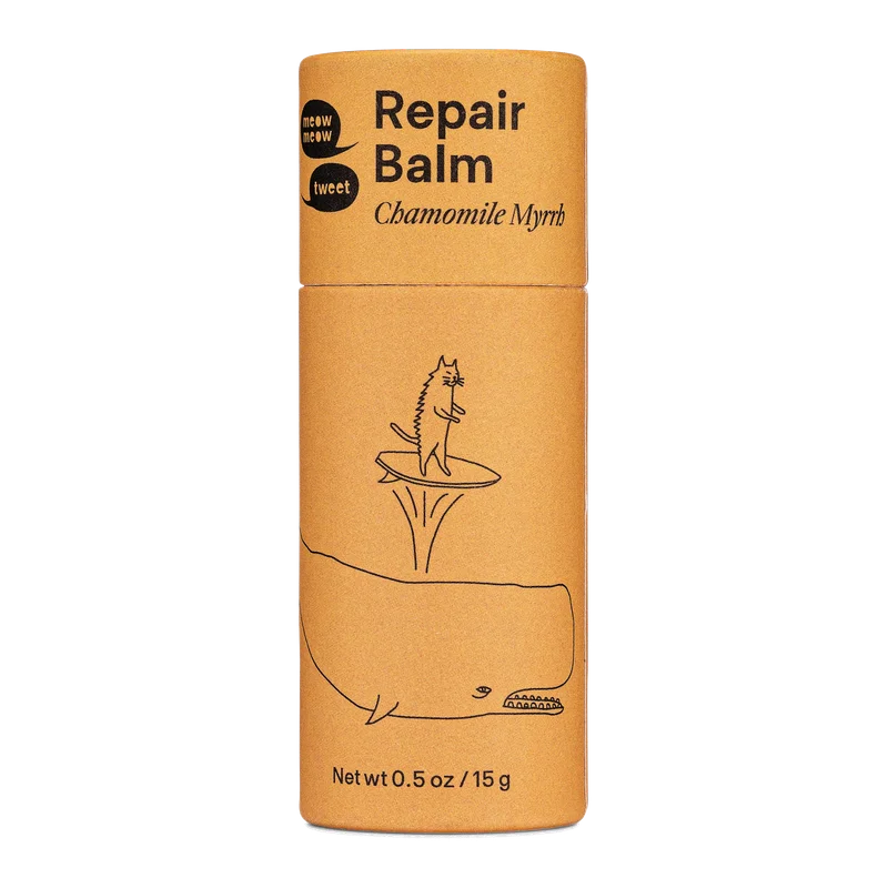 A golden light brown tube of Repair Balm