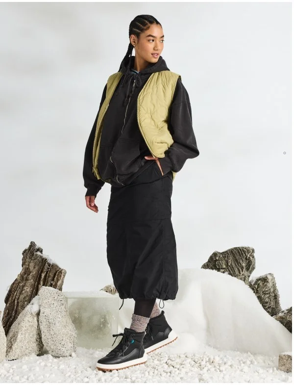 Picture of a female model wearing the Alta High Top.