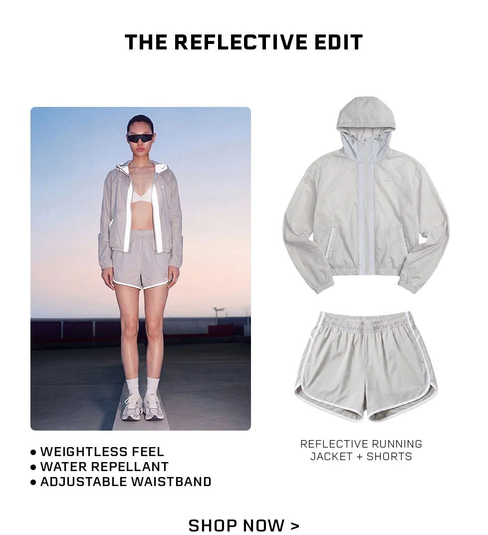 Women's reflective running jacket & shorts set. Water repellent, lightweight athletic gear for high-visibility runs. The Reflective Edit.