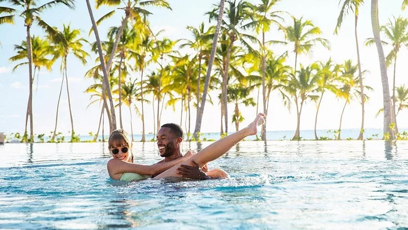 Image description: Couple in swimming pool at Hyatt Zilara Cap Cana.