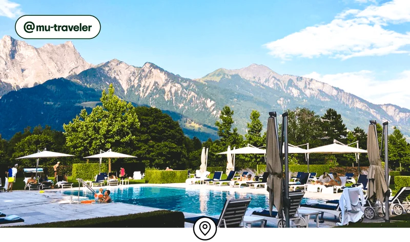 Image description: A resort pool with mountains in the background.