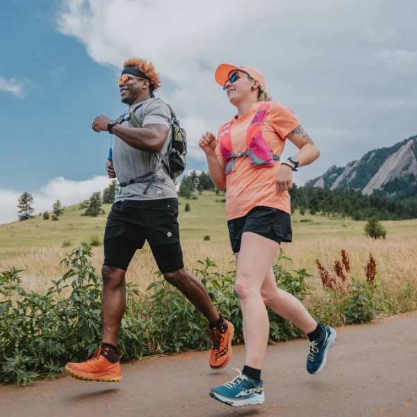 Runners wearing hydration packs