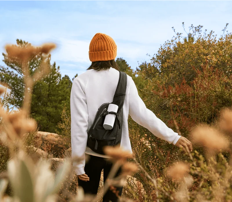 Sonos Roam 2 white young woman camping