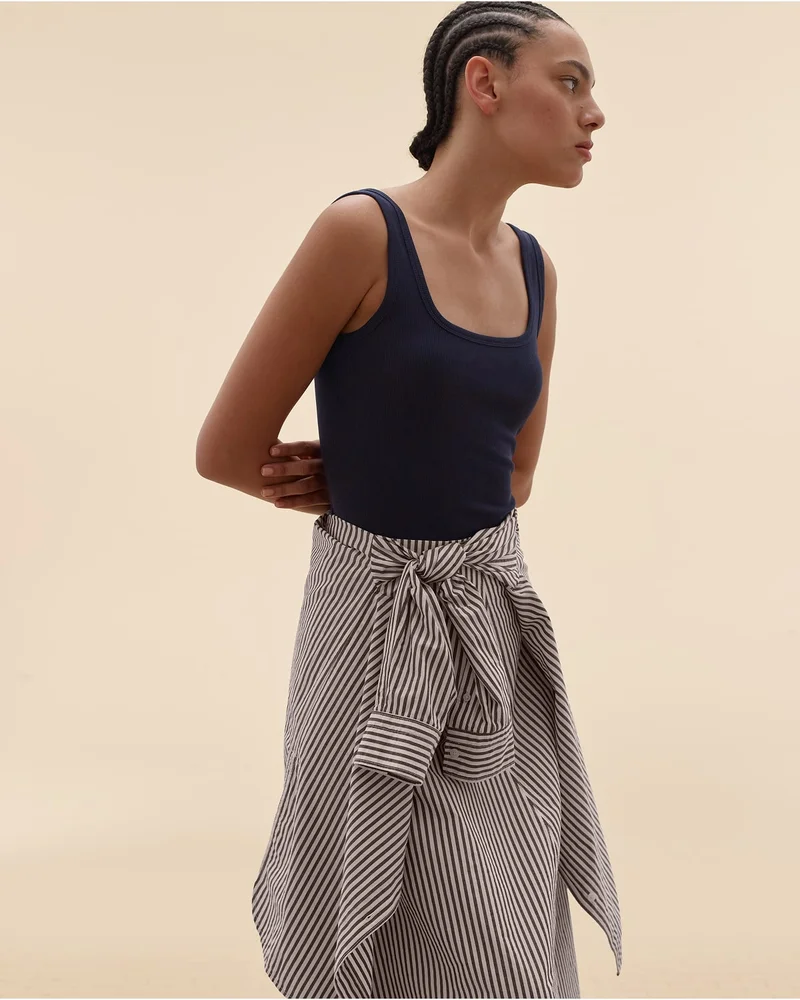 [Editorial Image]Model in The Luxe Rib Racerback Tank | The Boyfriend Shirt in Ultrasoft Cotton | The Midi Skirt in Ultrasoft Cotton