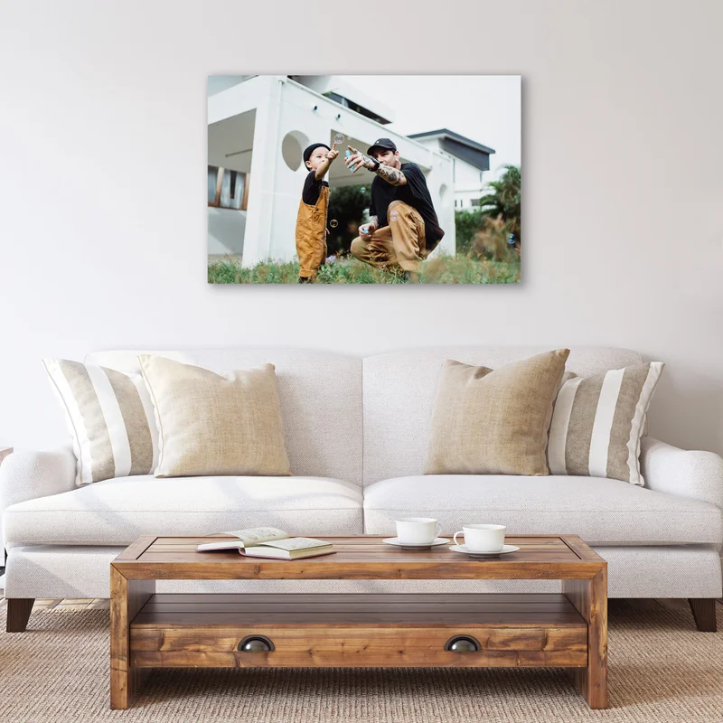 Canvas print in living room of father and son playing together.
