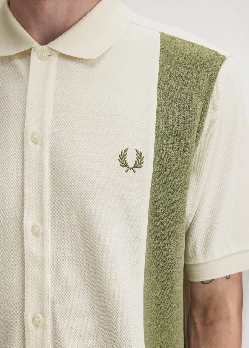 Ecru polo shirt with towelling sage green panels