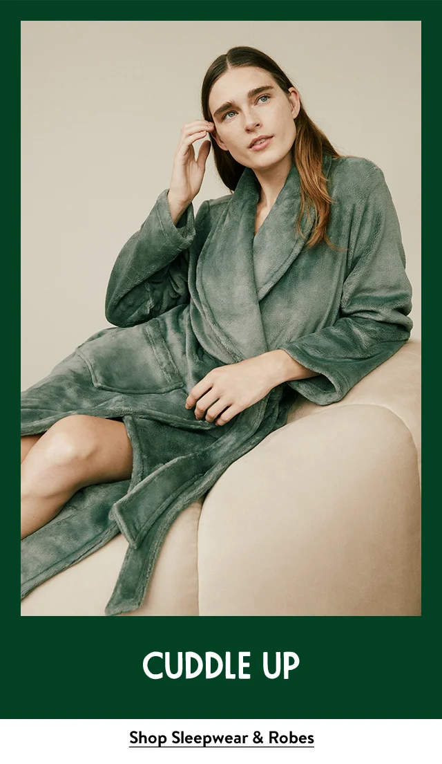 A model wearing a plush green robe.
