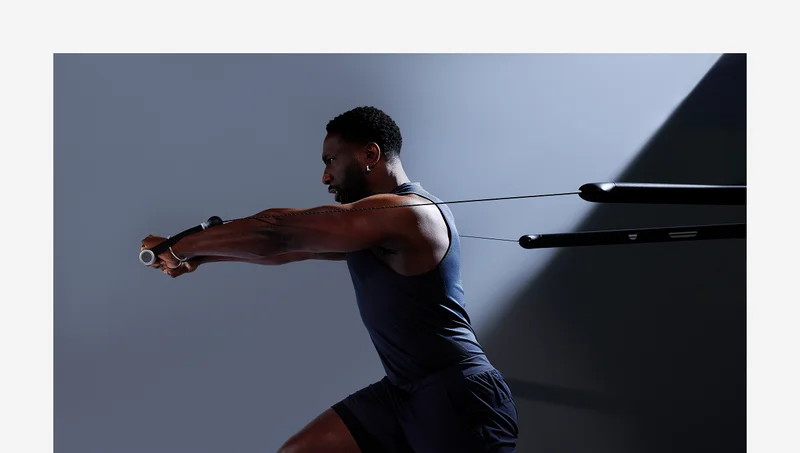 A man working out with Tonal