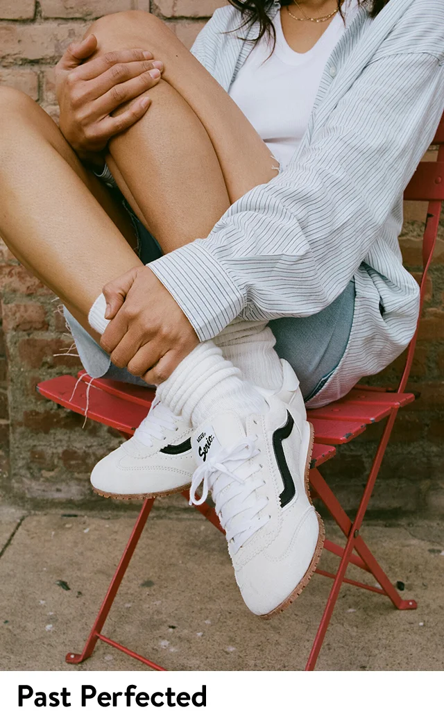 A woman wearing retro sneakers.