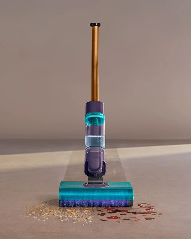 Dyson Clean+Wash Hygiene hard floor cleaner washing hard debris and liquid spills off the floor.