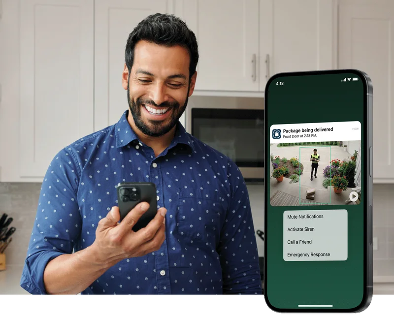 Phone displaying a simulated screen image of an Arlo Secure notification with animated preview. Background image depicts a person checking their phone.