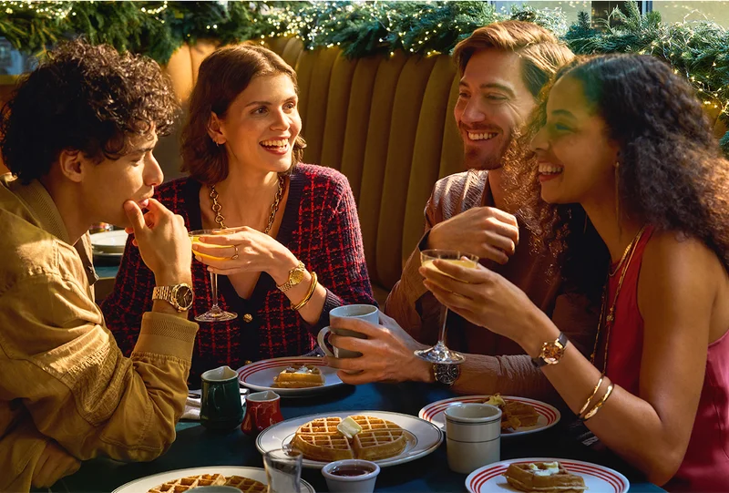Four people having brunch during the holidays