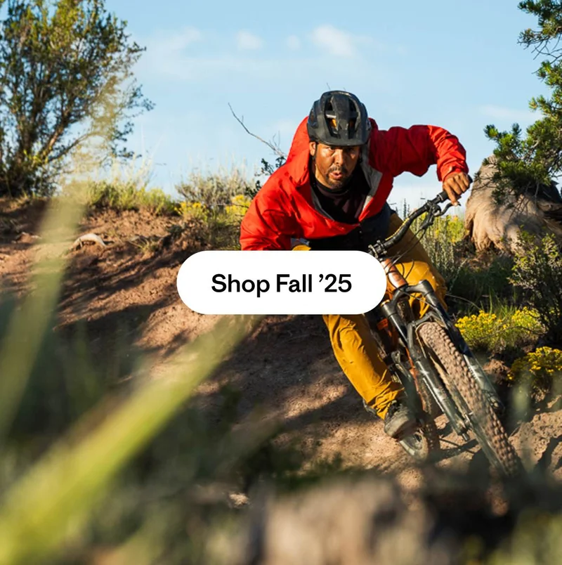 A mountain biker rides downhill.
