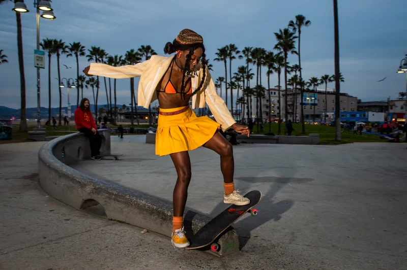 A woman skateboards at Venice Beach, in Los Angeles. Exercise, whether done solo or on a team, has physical and mental health benefits.