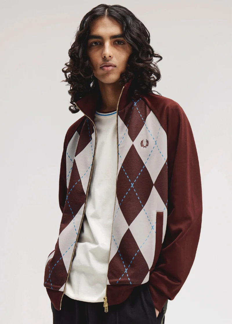 Male model wearing a Argyle Track Jacket in Oxblood