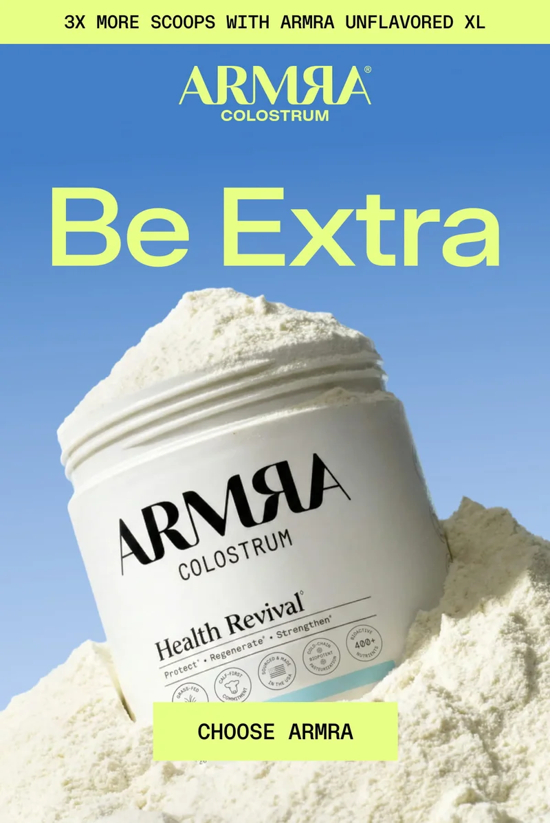 ARMRA Colostrum Unflavored XL jar emerging from powder with “Be Extra” headline.
