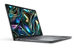 Side view of a Dell laptop computer on a dark gray                                                                     background.