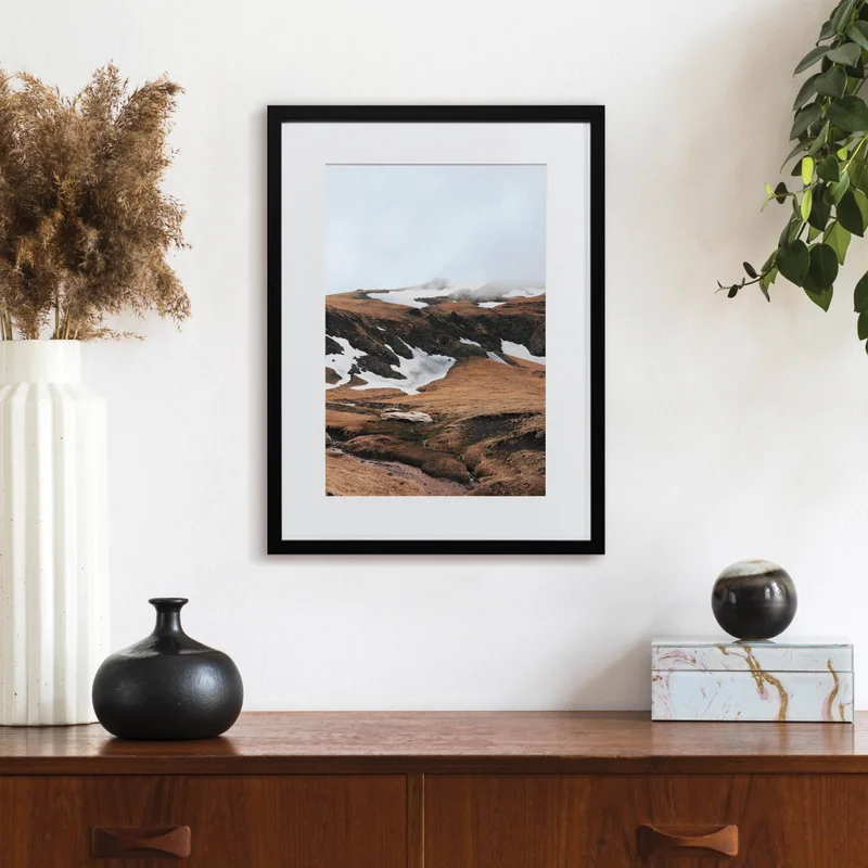 Framed print of mountains.