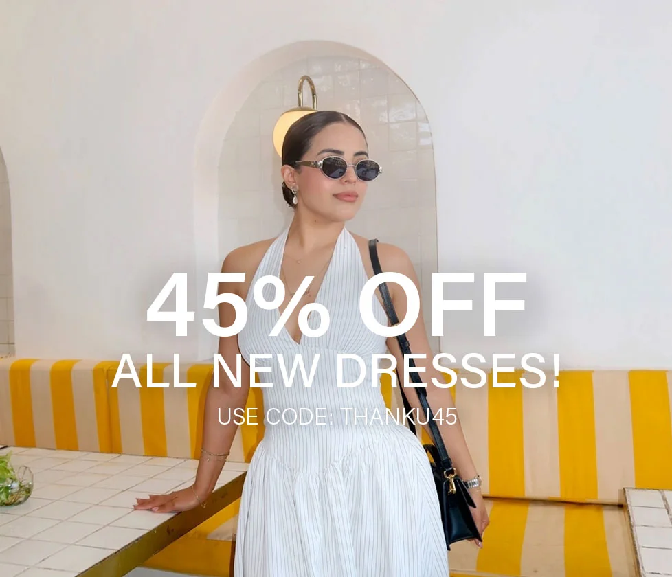 Model in white pinstripe halter dress promoting 45% off new spring & prom dresses with code discount code.