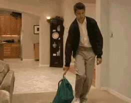 Gif of a boy dropping his backpack and fall to the ground from exhaustion.