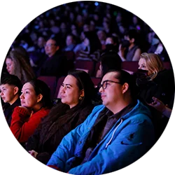A Latinx family watching a movie at a Sundance Film Festival theater.