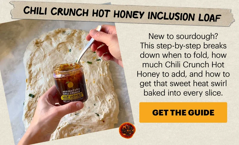 Header: CHILI CRUNCH SOURDOUGH IS EVERYWHERE Sub-header: National Sourdough Bread Day is April 1, and this year it’s all about what you fold into the dough. Bakers everywhere are adding Chili Crunch — and getting crispy crusts, savory pockets, and just enough heat in every slice. CTA: GET THE GUIDE