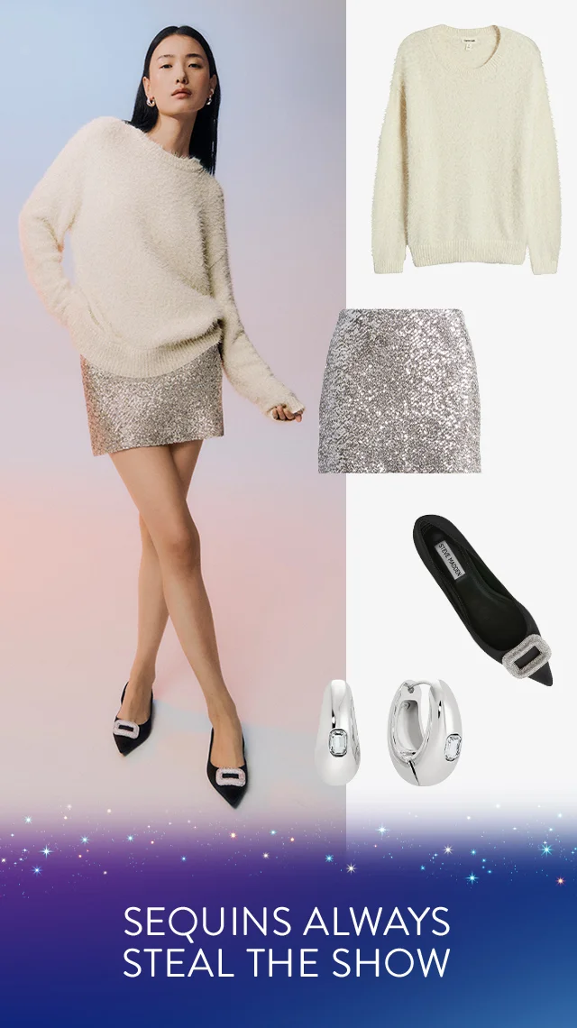 A woman wearing a white sweater with a shiny miniskirt, silver hoop earrings and black pointed-toe flats.