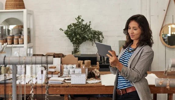 Jewelry store owner looking at a tablet