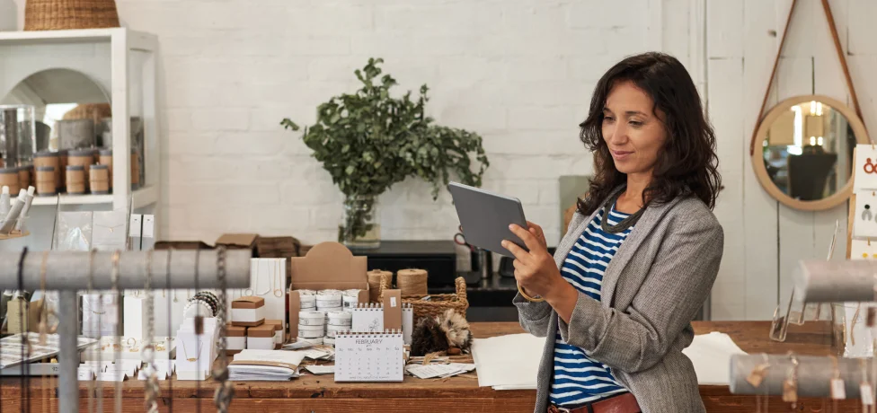 Jewelry store owner looking at a tablet