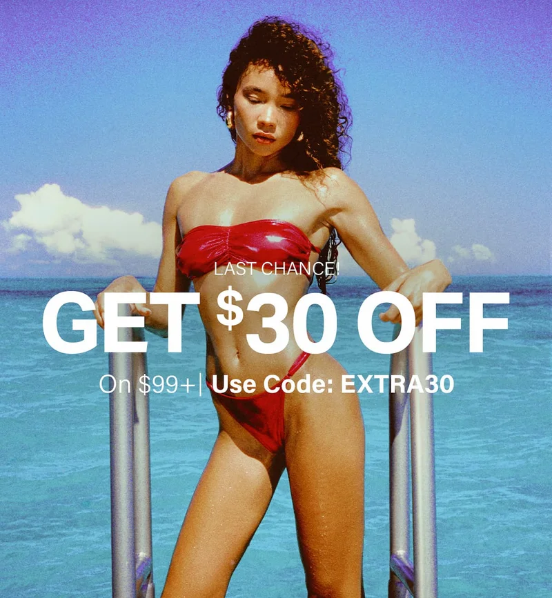 Get $30 OFF $99+ on swimwear! Last chance, use code discount code. Woman in red bikini by tropical water.